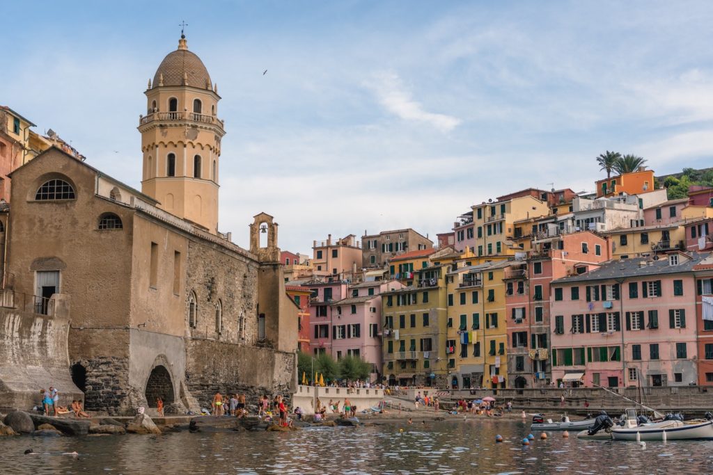 colourful buildings in italy next to a lake